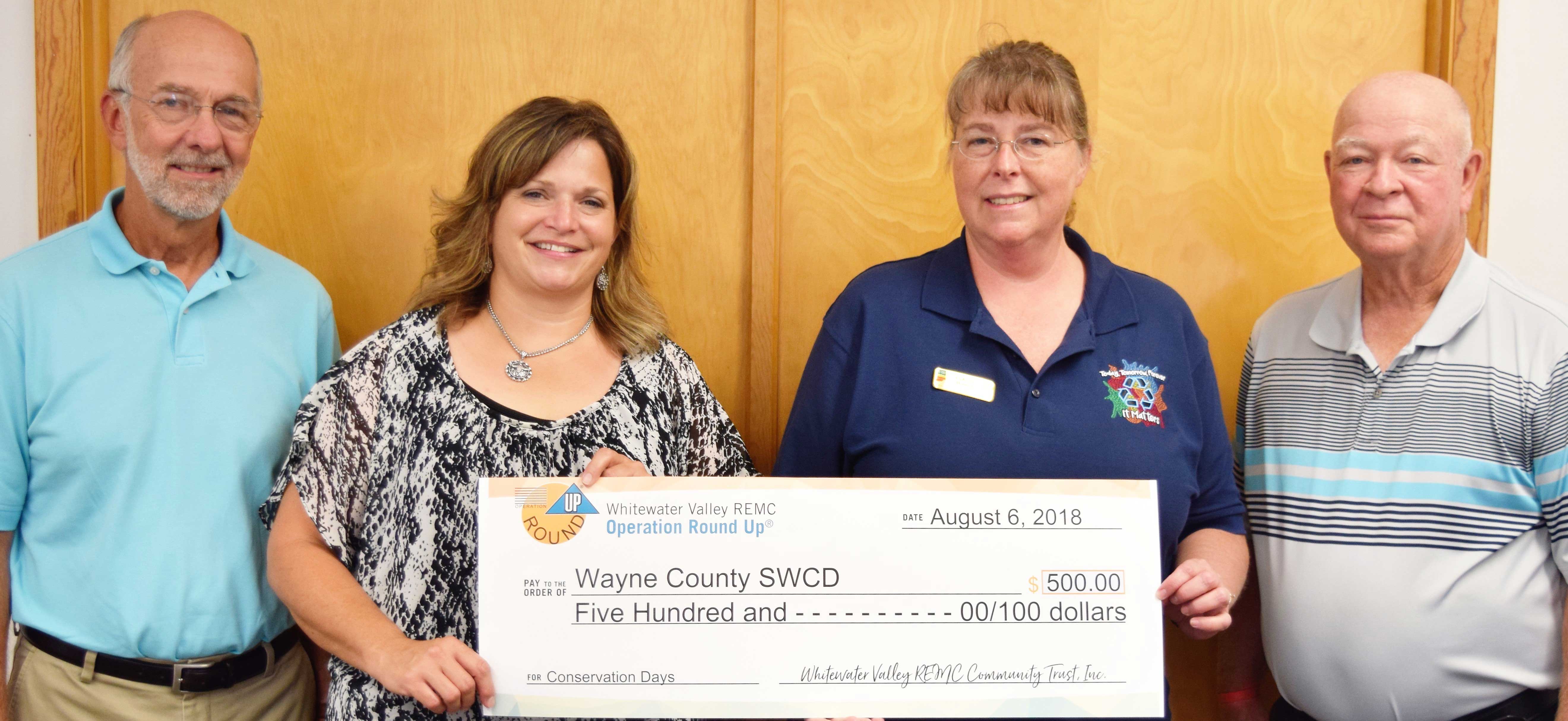 Soil and Water Recieving Grant Check